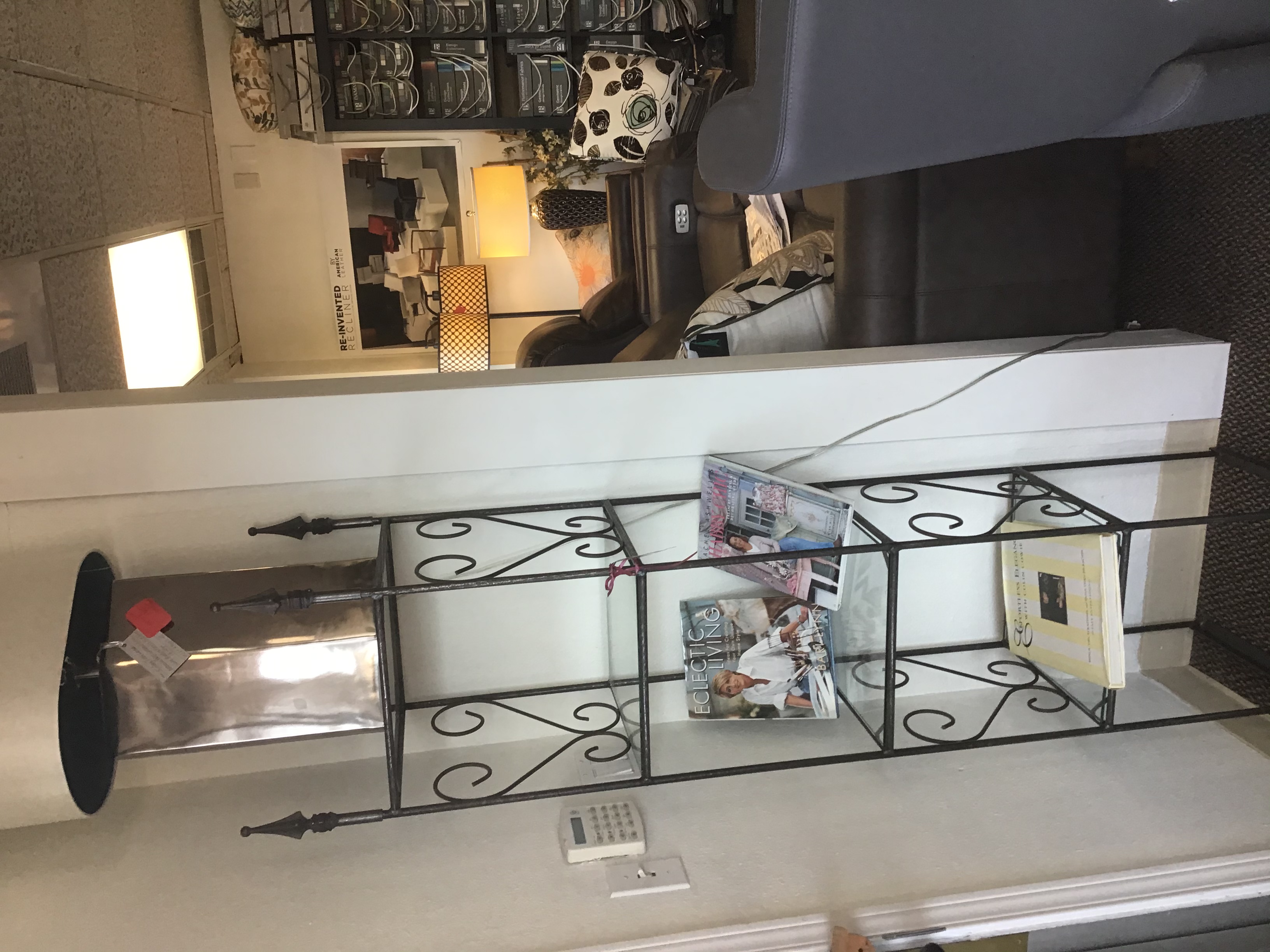 Small tall wrought iron shelf unit with glass shel